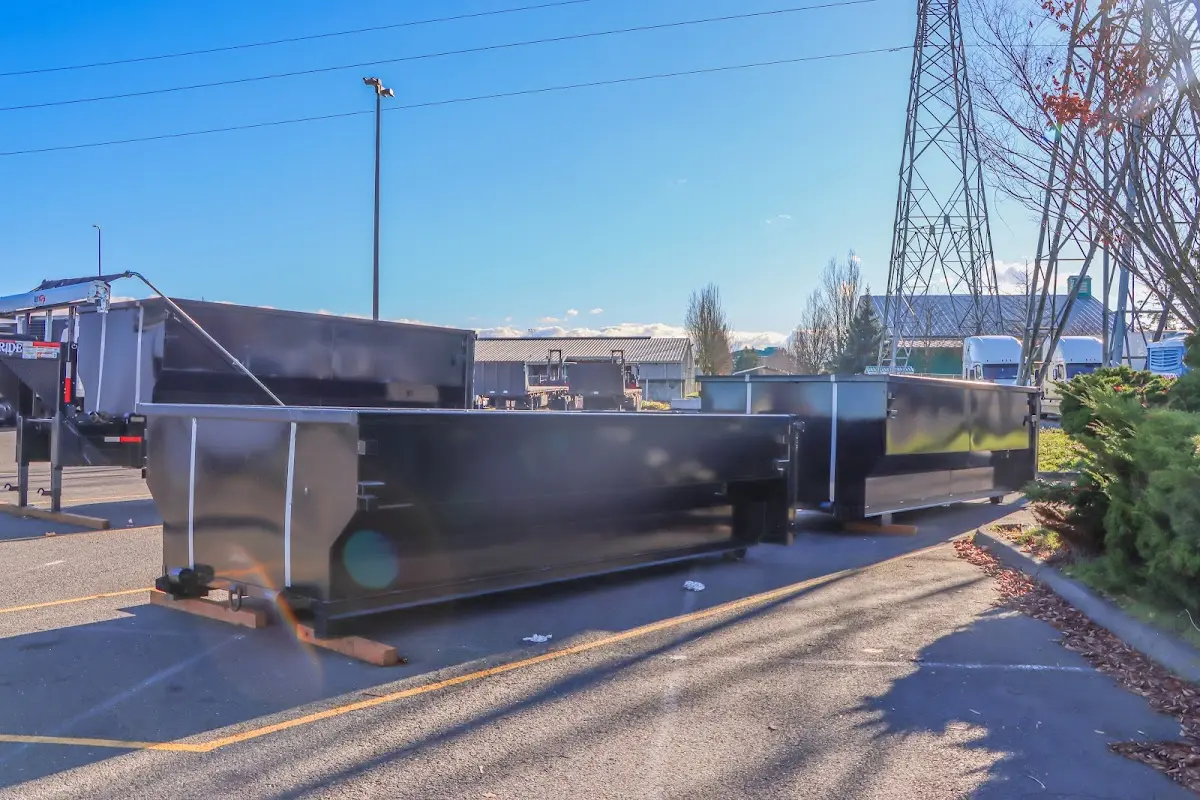 Roll-off dumpster ready for waste disposal at job site for Concrete Dumpster Rental in Paw Paw